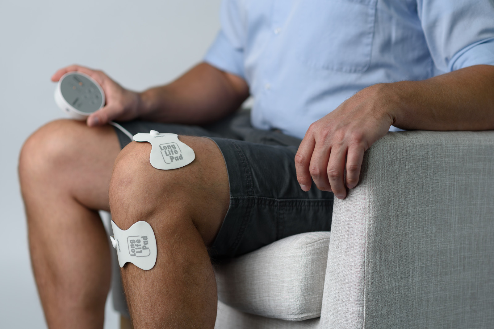 Man using TENS device