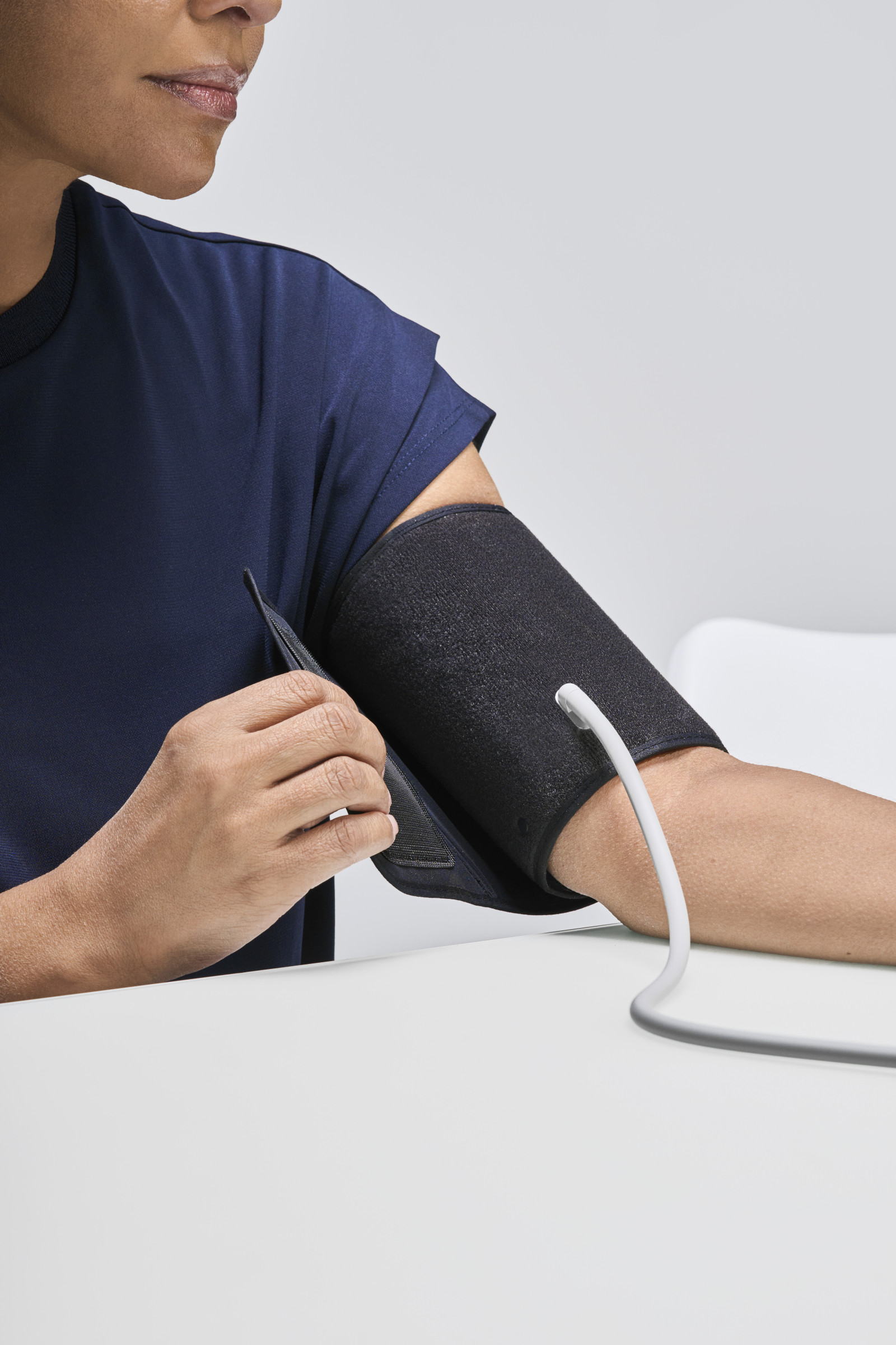 Woman putting on ComFit cuff