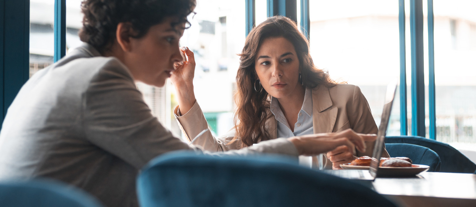 Two women working on laptop