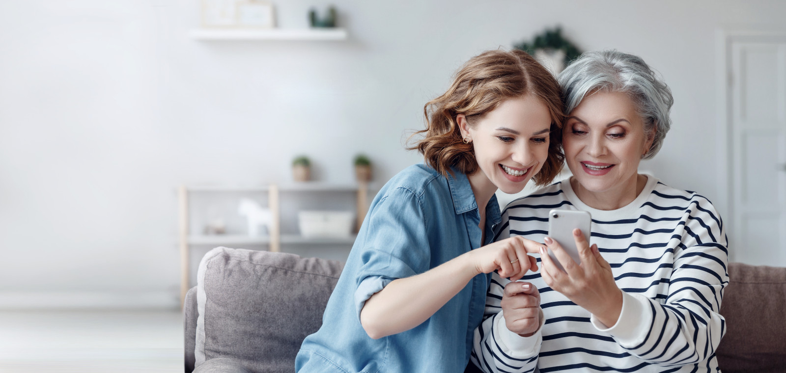 Mother and daughter looking at phone