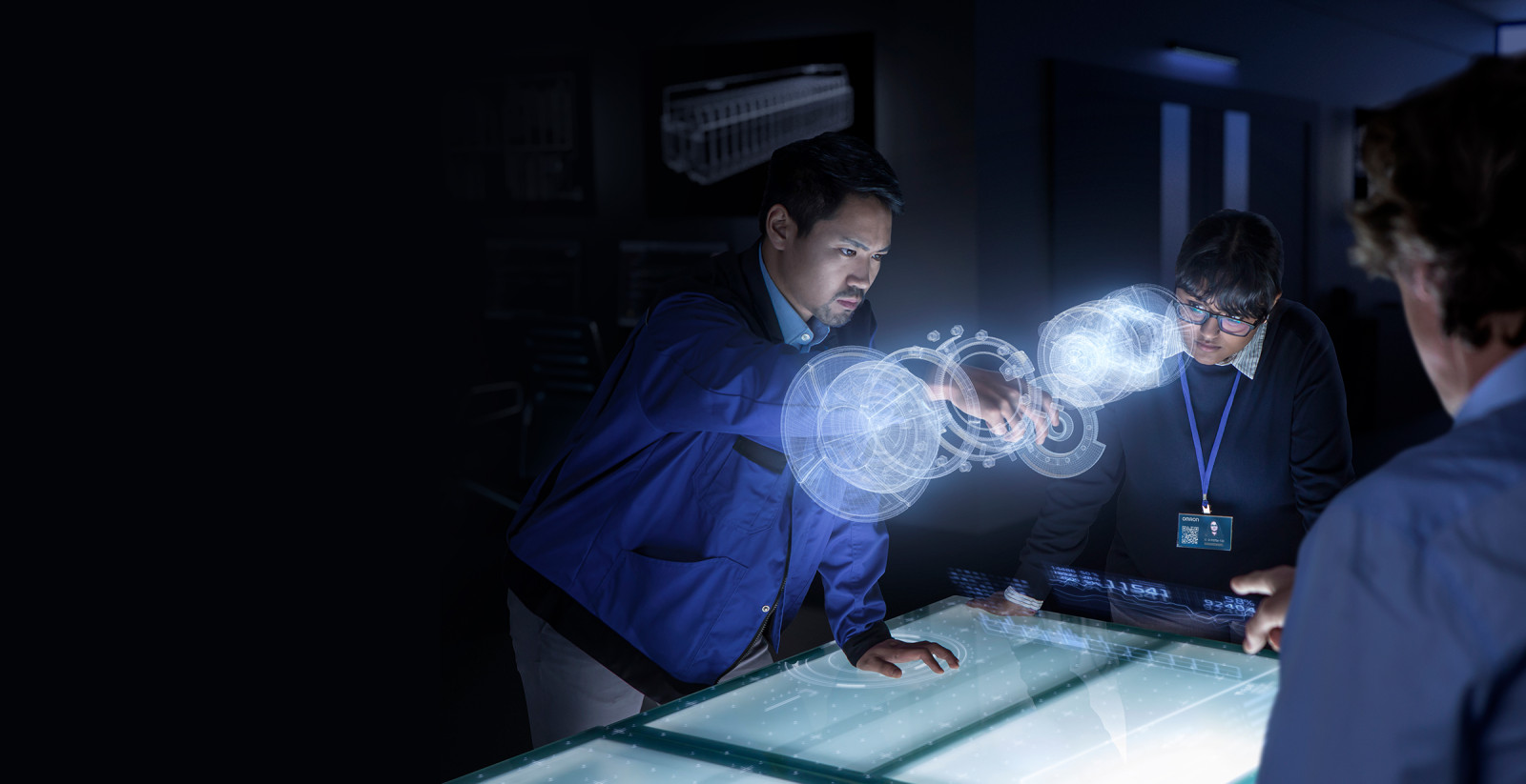 Engineers standing around work station