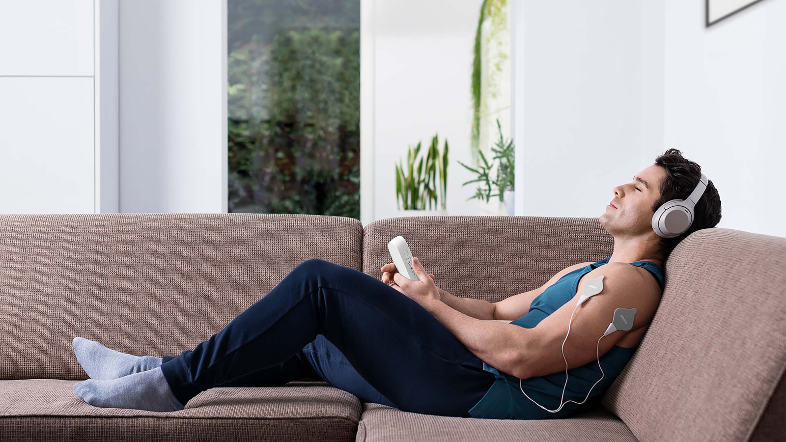 Man using TENS device